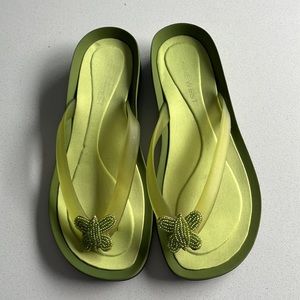 Never used flip flops. Lime green with beaded butterfly. Size 7